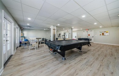 This 2-bedroom, 1.5-bath condo comes fully furnished and on The Dunedin Country Club in Florida - for sale on GolfHomes.com, golf home, golf lot