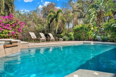 Welcome to this stunning pool home nestled in the exclusive on Eagle Creek Golf Club in Florida - for sale on GolfHomes.com, golf home, golf lot