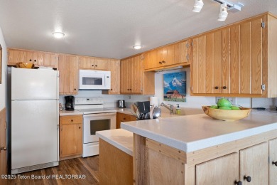 This beautifully updated two-bedroom, two-bath townhome with a on Jackson Hole Golf and Tennis Club in Wyoming - for sale on GolfHomes.com, golf home, golf lot