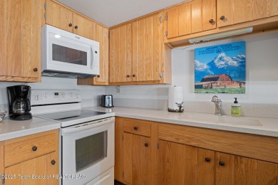This beautifully updated two-bedroom, two-bath townhome with a on Jackson Hole Golf and Tennis Club in Wyoming - for sale on GolfHomes.com, golf home, golf lot