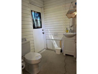 This a one bedroom and one bath with very a large addition on Silver Dollar Golf and Trap Club in Florida - for sale on GolfHomes.com, golf home, golf lot