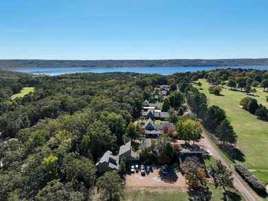 This FURNISHED Eden Isle townhome is right across the street on Red Apple Inn and Country Club in Arkansas - for sale on GolfHomes.com, golf home, golf lot