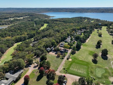 This FURNISHED Eden Isle townhome is right across the street on Red Apple Inn and Country Club in Arkansas - for sale on GolfHomes.com, golf home, golf lot