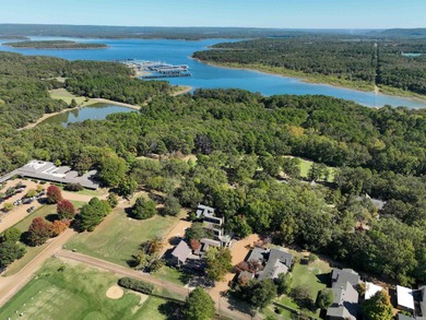 This FURNISHED Eden Isle townhome is right across the street on Red Apple Inn and Country Club in Arkansas - for sale on GolfHomes.com, golf home, golf lot
