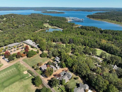 This FURNISHED Eden Isle townhome is right across the street on Red Apple Inn and Country Club in Arkansas - for sale on GolfHomes.com, golf home, golf lot