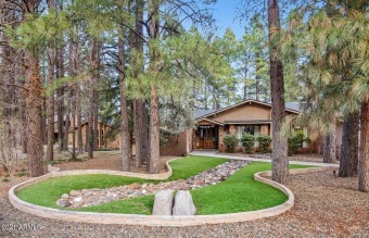 This SINGLE LEVEL residence is a rare find on a cul-de-sac on Aspen Valley Golf Club in Arizona - for sale on GolfHomes.com, golf home, golf lot