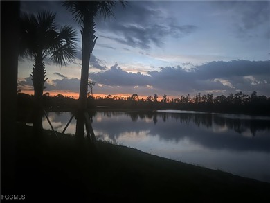 Wake up to shimmering water views and end every day with on Heritage Landing Golf  in Florida - for sale on GolfHomes.com, golf home, golf lot