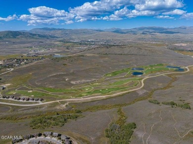 Perched on a scenic ridge with sweeping views of open space on Headwaters Golf Course At Granby Ranch in Colorado - for sale on GolfHomes.com, golf home, golf lot