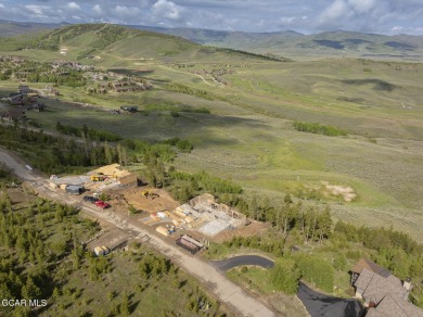 Perched on a scenic ridge with sweeping views of open space on Headwaters Golf Course At Granby Ranch in Colorado - for sale on GolfHomes.com, golf home, golf lot