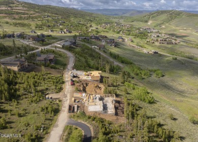 Perched on a scenic ridge with sweeping views of open space on Headwaters Golf Course At Granby Ranch in Colorado - for sale on GolfHomes.com, golf home, golf lot