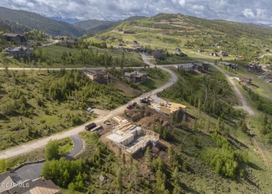 Perched on a scenic ridge with sweeping views of open space on Headwaters Golf Course At Granby Ranch in Colorado - for sale on GolfHomes.com, golf home, golf lot