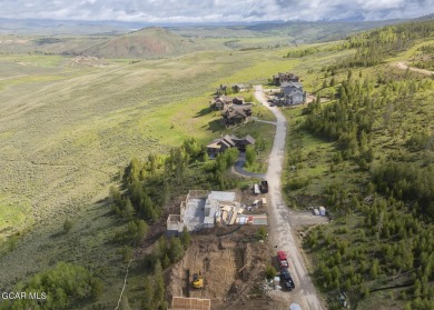 Perched on a scenic ridge with sweeping views of open space on Headwaters Golf Course At Granby Ranch in Colorado - for sale on GolfHomes.com, golf home, golf lot