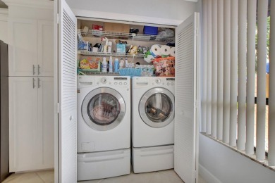 This stunning first-floor condo offers a spacious and modern on Boca Pointe Country Club in Florida - for sale on GolfHomes.com, golf home, golf lot