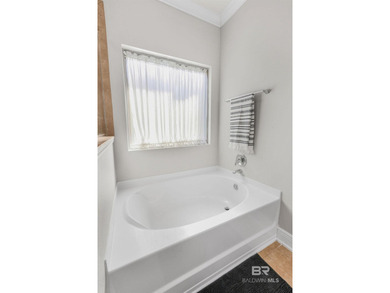 This beautifully maintained Gold Fortified 4 bedroom, 3.5 bath on Craft Farms - Cypress Bend in Alabama - for sale on GolfHomes.com, golf home, golf lot