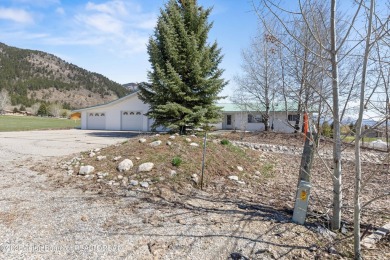 Beautifully landscaped and ideally situated on the 11th fairway on Star Valley RV Golf Course in Wyoming - for sale on GolfHomes.com, golf home, golf lot