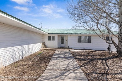 Beautifully landscaped and ideally situated on the 11th fairway on Star Valley RV Golf Course in Wyoming - for sale on GolfHomes.com, golf home, golf lot