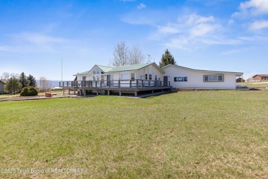 Beautifully landscaped and ideally situated on the 11th fairway on Star Valley RV Golf Course in Wyoming - for sale on GolfHomes.com, golf home, golf lot