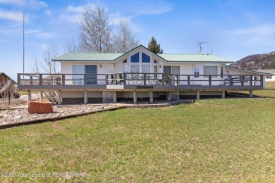 Beautifully landscaped and ideally situated on the 11th fairway on Star Valley RV Golf Course in Wyoming - for sale on GolfHomes.com, golf home, golf lot