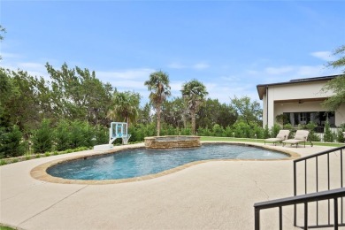 This custom home boasts captivating curb appeal and is an on The Hills of Lakeway Golf Course in Texas - for sale on GolfHomes.com, golf home, golf lot