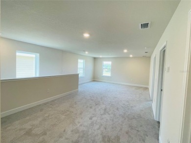 This brand new 4 bedroom, 2.5 bathroom residence offers on Harmony Golf Preserve in Florida - for sale on GolfHomes.com, golf home, golf lot