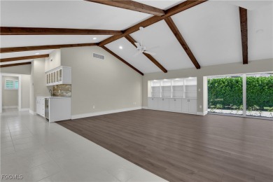 Boasting 3 bedrooms plus a den, 2.5 baths, and a 2-car garage on LaPlaya Golf Club in Florida - for sale on GolfHomes.com, golf home, golf lot
