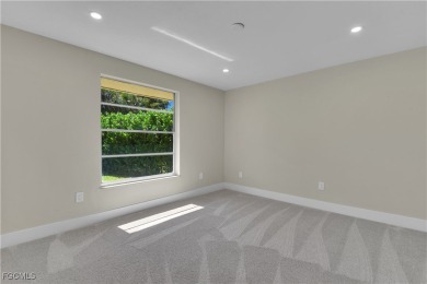 Boasting 3 bedrooms plus a den, 2.5 baths, and a 2-car garage on LaPlaya Golf Club in Florida - for sale on GolfHomes.com, golf home, golf lot