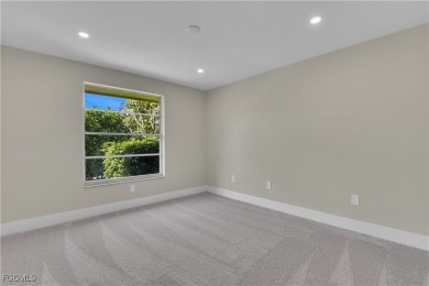 Boasting 3 bedrooms plus a den, 2.5 baths, and a 2-car garage on LaPlaya Golf Club in Florida - for sale on GolfHomes.com, golf home, golf lot
