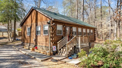 CHARMING LOG CABIN STYLE BUILD-OVER SITS PRETTY ON TRIPLE LOT!!! on River Golf and Country Club at Lake Royale in North Carolina - for sale on GolfHomes.com, golf home, golf lot