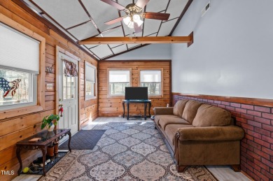 CHARMING LOG CABIN STYLE BUILD-OVER SITS PRETTY ON TRIPLE LOT!!! on River Golf and Country Club at Lake Royale in North Carolina - for sale on GolfHomes.com, golf home, golf lot