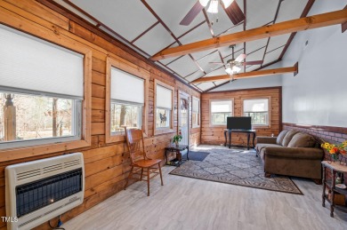 CHARMING LOG CABIN STYLE BUILD-OVER SITS PRETTY ON TRIPLE LOT!!! on River Golf and Country Club at Lake Royale in North Carolina - for sale on GolfHomes.com, golf home, golf lot