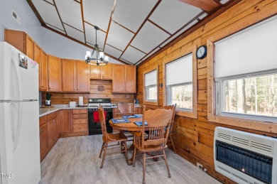 CHARMING LOG CABIN STYLE BUILD-OVER SITS PRETTY ON TRIPLE LOT!!! on River Golf and Country Club at Lake Royale in North Carolina - for sale on GolfHomes.com, golf home, golf lot