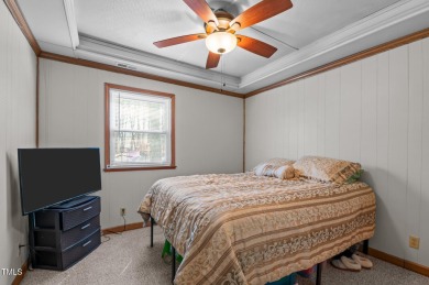 CHARMING LOG CABIN STYLE BUILD-OVER SITS PRETTY ON TRIPLE LOT!!! on River Golf and Country Club at Lake Royale in North Carolina - for sale on GolfHomes.com, golf home, golf lot