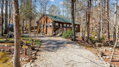 CHARMING LOG CABIN STYLE BUILD-OVER SITS PRETTY ON TRIPLE LOT!!! on River Golf and Country Club at Lake Royale in North Carolina - for sale on GolfHomes.com, golf home, golf lot