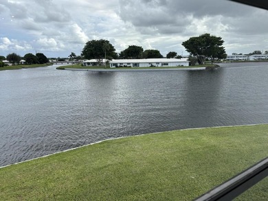 Enjoy expansive, picturesque water views from this completely on Leisureville Community Golf Course in Florida - for sale on GolfHomes.com, golf home, golf lot