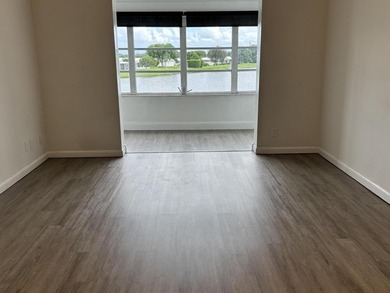 Enjoy expansive, picturesque water views from this completely on Leisureville Community Golf Course in Florida - for sale on GolfHomes.com, golf home, golf lot