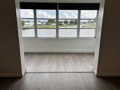 Enjoy expansive, picturesque water views from this completely on Leisureville Community Golf Course in Florida - for sale on GolfHomes.com, golf home, golf lot