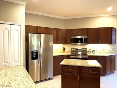 THIS LOVELY HOME IS A MUST SEE TO BELIEVE! This Lovely Home has on Gateway Golf and Country Club in Florida - for sale on GolfHomes.com, golf home, golf lot