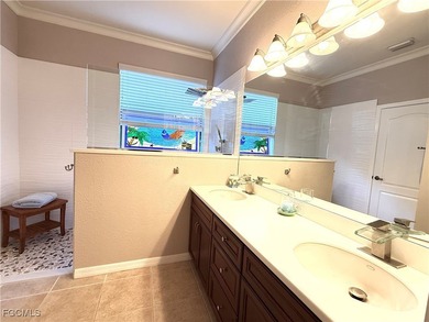 THIS LOVELY HOME IS A MUST SEE TO BELIEVE! This Lovely Home has on Gateway Golf and Country Club in Florida - for sale on GolfHomes.com, golf home, golf lot