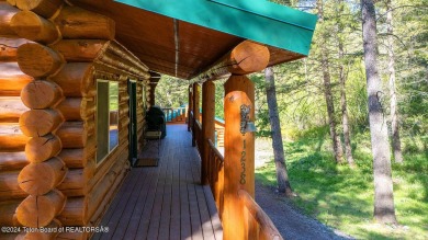 Escape to your own hand-hewn log retreat nestled in the woods of on Star Valley RV Golf Course in Wyoming - for sale on GolfHomes.com, golf home, golf lot