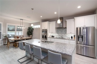 Elegant, beautifully landscaped Lee Wetherington 2-Bedroom on River Wilderness Golf and Country Club in Florida - for sale on GolfHomes.com, golf home, golf lot