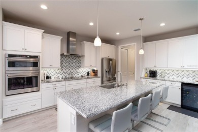 Elegant, beautifully landscaped Lee Wetherington 2-Bedroom on River Wilderness Golf and Country Club in Florida - for sale on GolfHomes.com, golf home, golf lot