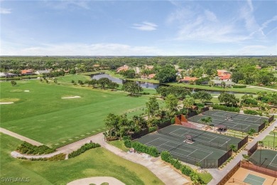 Indulge in breathtaking lake and golf course views from this on Fiddlesticks Country Club in Florida - for sale on GolfHomes.com, golf home, golf lot