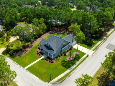 This nearly new residence is situated on a corner lot within the on Members Club At St. James Plantation in North Carolina - for sale on GolfHomes.com, golf home, golf lot
