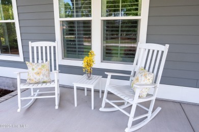 This nearly new residence is situated on a corner lot within the on Members Club At St. James Plantation in North Carolina - for sale on GolfHomes.com, golf home, golf lot