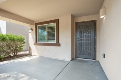 Located in Rancho Vistoso, this Elevation C Plan with Stone sits on The Golf Club at Vistoso in Arizona - for sale on GolfHomes.com, golf home, golf lot