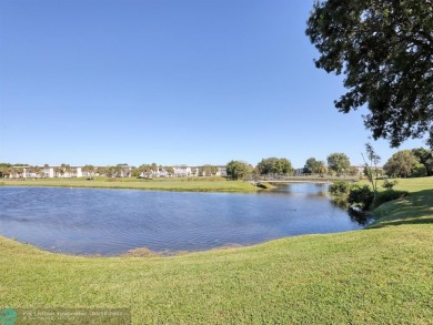 55+1/1.5*LAKE VIEW FROM ENCLOSED PATIO  CENTRAL PARK-LIKE on Wynmoor Golf Course in Florida - for sale on GolfHomes.com, golf home, golf lot