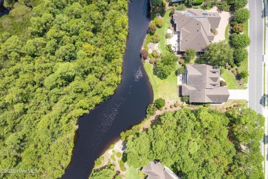 This elegant all-brick, one-level home is perfectly situated in on Reserve Club At St James Plantation in North Carolina - for sale on GolfHomes.com, golf home, golf lot