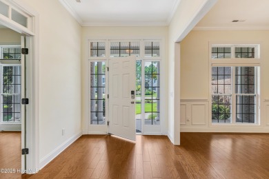This elegant all-brick, one-level home is perfectly situated in on Reserve Club At St James Plantation in North Carolina - for sale on GolfHomes.com, golf home, golf lot