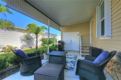 2022 Model home features accordion hurricane shutters, double on Barefoot Bay Golf Course in Florida - for sale on GolfHomes.com, golf home, golf lot