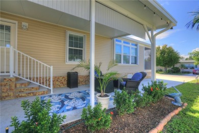 2022 Model home features accordion hurricane shutters, double on Barefoot Bay Golf Course in Florida - for sale on GolfHomes.com, golf home, golf lot